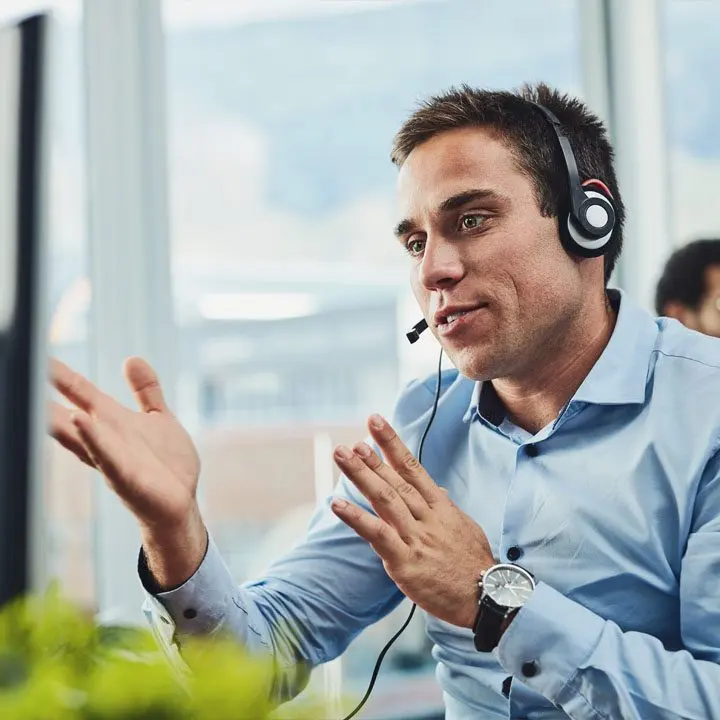 A support consultant talking through an HR case on a headset call